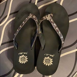 Yellow box flip flops.